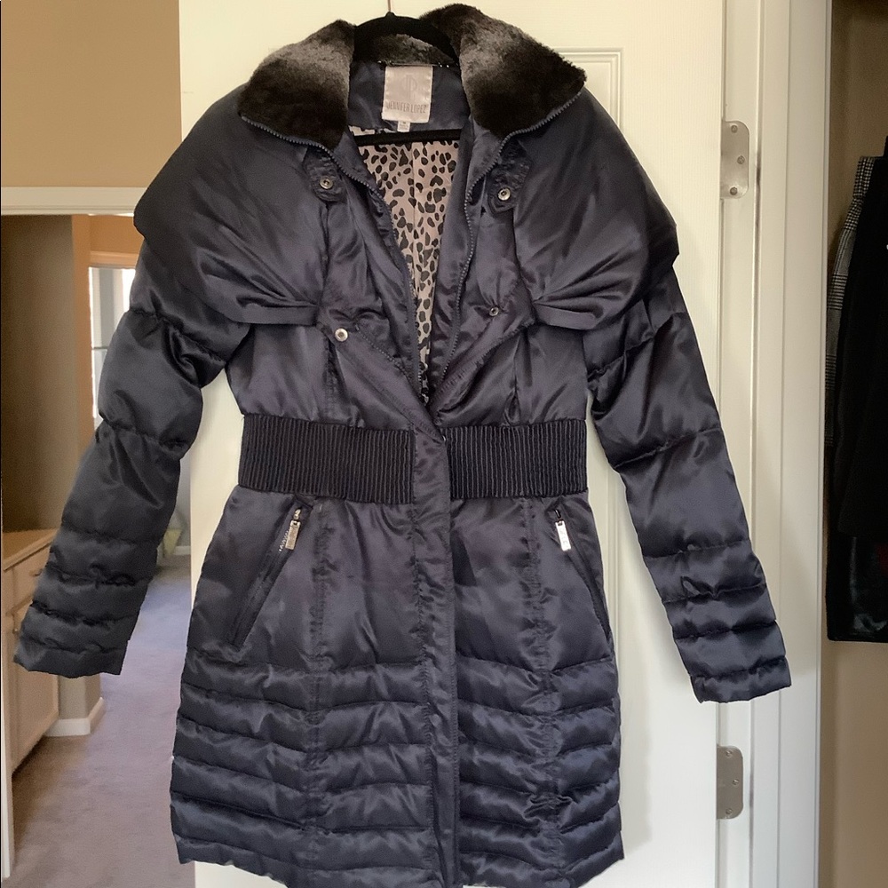 Jennifer Lopez navy puffer coat with fur collar.